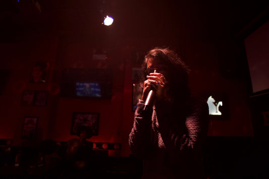 moody red-lit photo of local chicago artist jbex